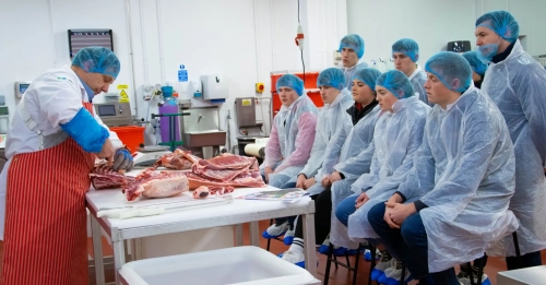 Students watching butchery demonstration